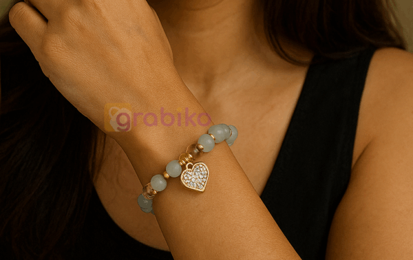 Grey labradorite bead bracelet with gold heart charm and crystal stones for women – stylish handmade jewelry by Grabiko.