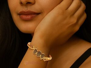 Elegant gold-plated bracelet with triple oval motif design, studded with sparkling stones