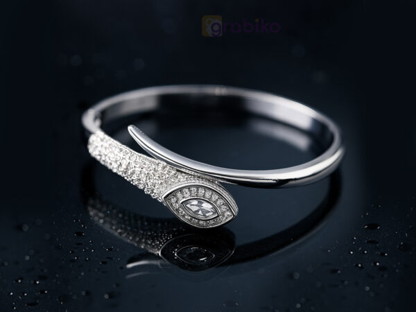 Elegant silver bracelet with eye motif design, studded with sparkling cubic zirconia stones