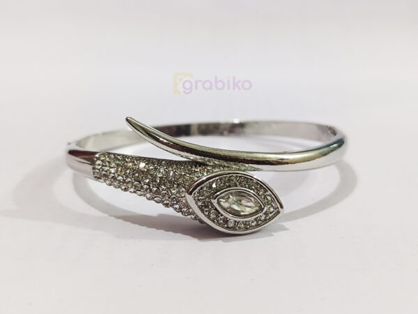 Elegant silver bracelet with eye motif design, studded with sparkling cubic zirconia stones