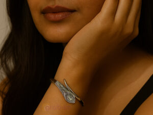 Elegant silver bracelet with eye motif design, studded with sparkling cubic zirconia stones