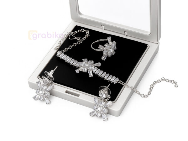Silver snowflake jewelry set with earrings, bracelet, and ring adorned with cubic zirconia stones