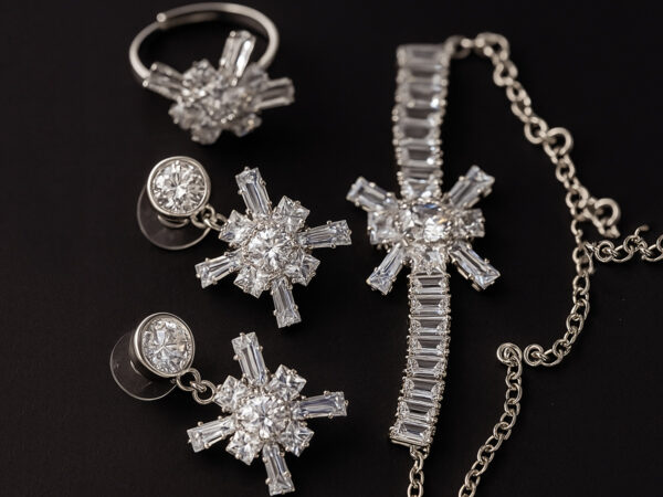 Silver snowflake jewelry set with earrings, bracelet, and ring adorned with cubic zirconia stones