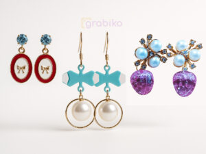 Trendy 3-pair earring combo for women with bow studs, pearl hoops, and crystal pink drop earrings.