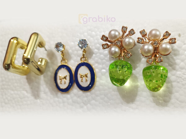 Elegant 3-pair earring combo with gold hoops, blue bow charm dangles, and pearl floral green drop earrings.