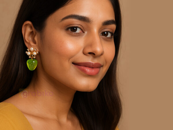 Elegant 3-pair earring combo with gold hoops, blue bow charm dangles, and pearl floral green drop earrings.