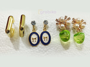 Elegant 3-pair earring combo with gold hoops, blue bow charm dangles, and pearl floral green drop earrings.