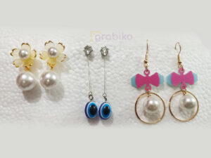 Combo set of 3 stylish earrings for women – pearl studs, evil eye danglers, and bow hoop pearls