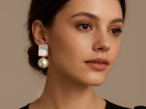 Stylish pearl drop earrings with American diamond square crystals and gold-tone frame