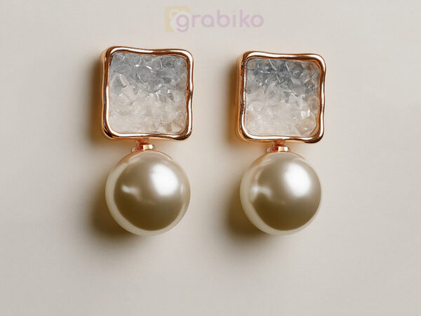 Stylish pearl drop earrings with American diamond square crystals and gold-tone frame