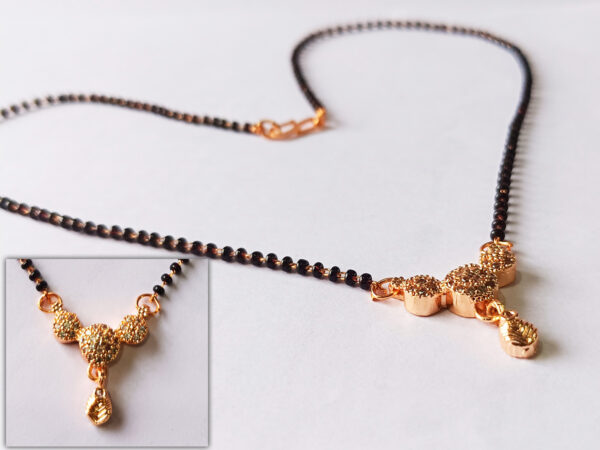 Rose gold mangalsutra with black beads and designer pendant