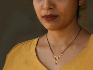 Rose gold mangalsutra with black beads and designer pendant