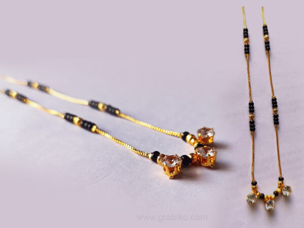 Dual-layer gold-plated necklace with black stone pendant and American diamond crystals