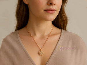 Rose gold magnetic necklace with convertible heart and clover pendant.