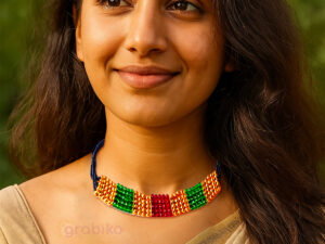 Traditional Indian mangalsutra necklace with black beads and colorful golden, green, and red patches